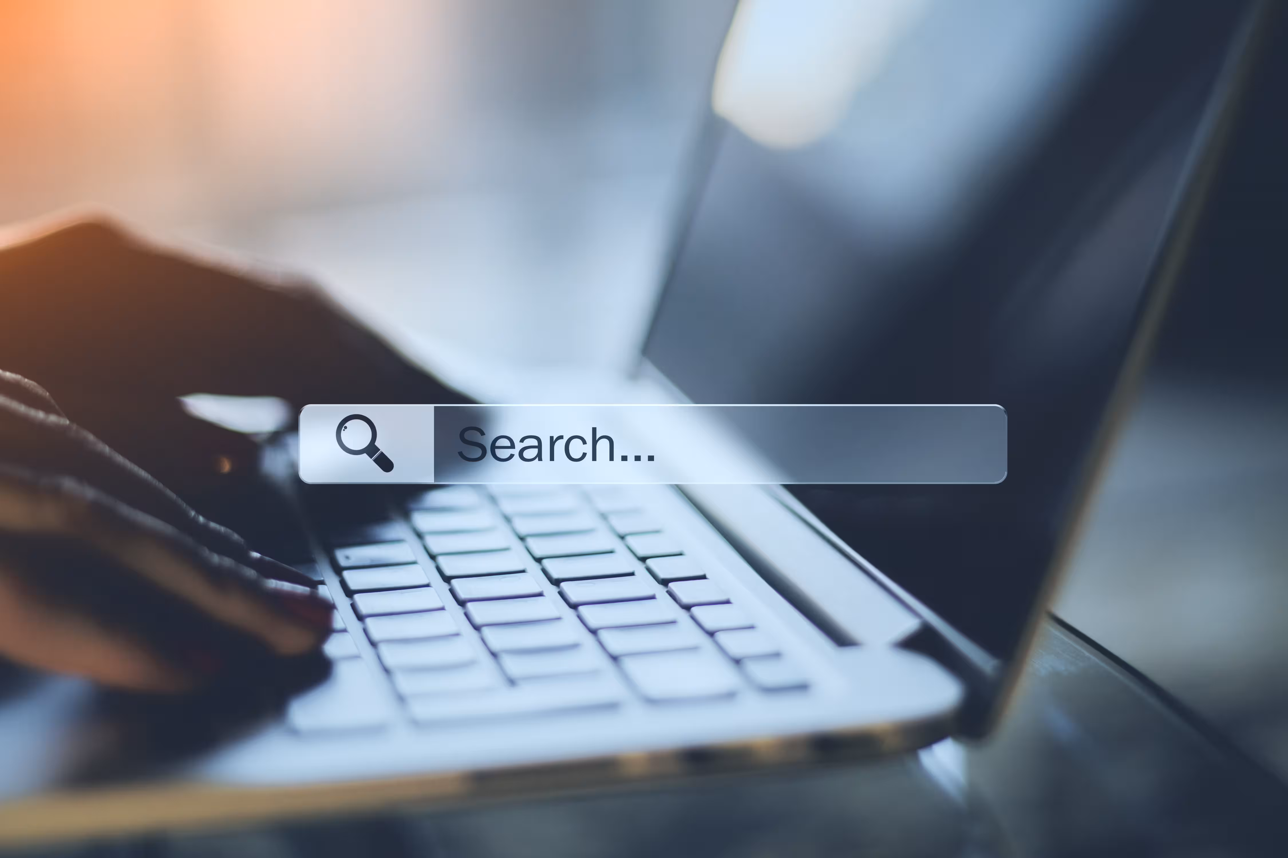 Person searching online on a laptop