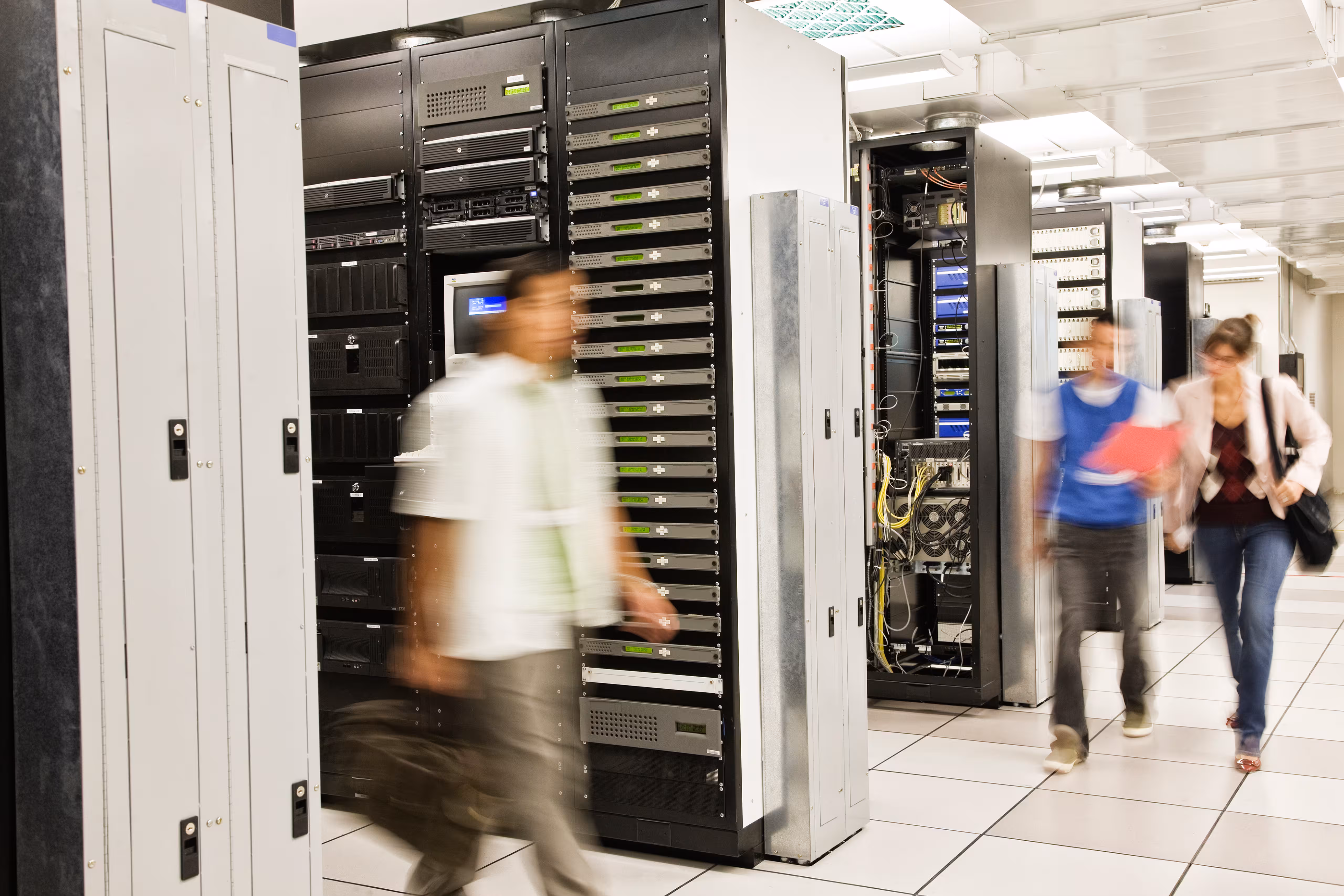 People walking in a server room